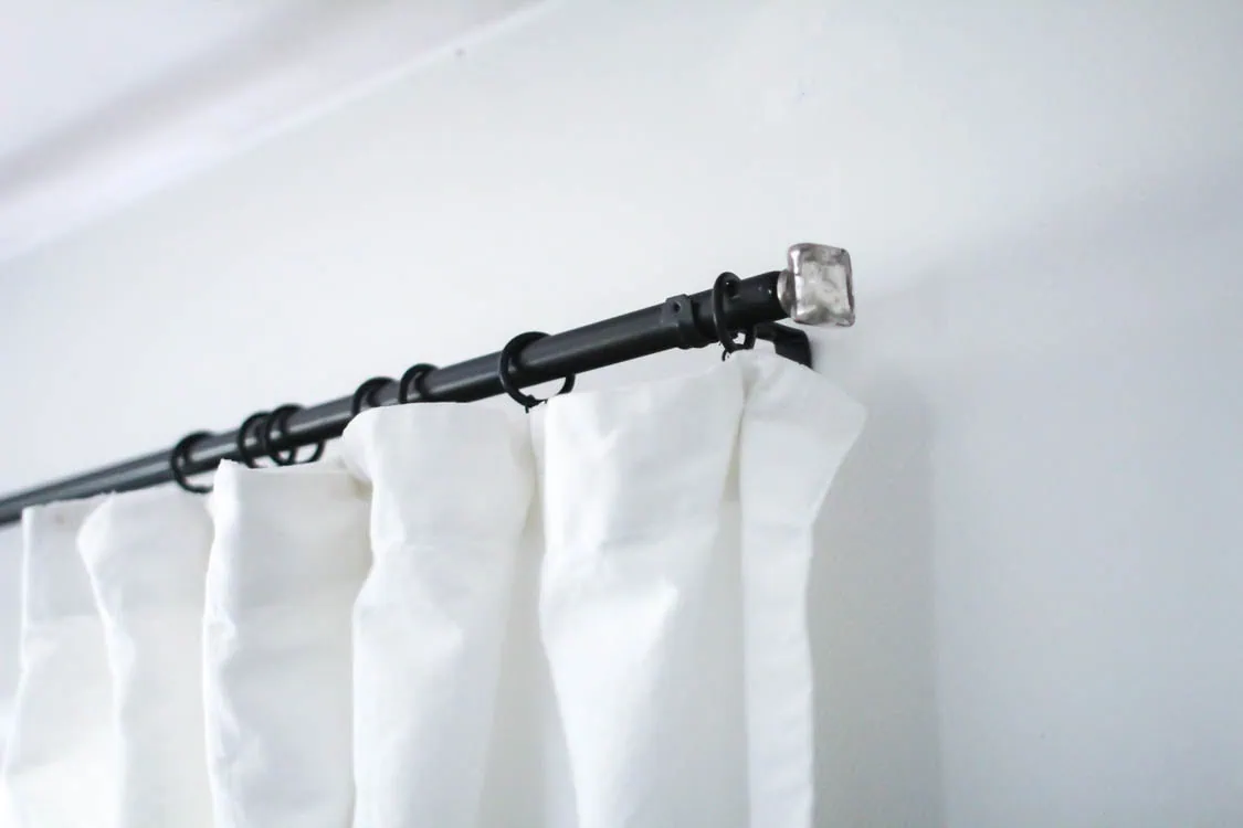 curtain rods spray painted black.