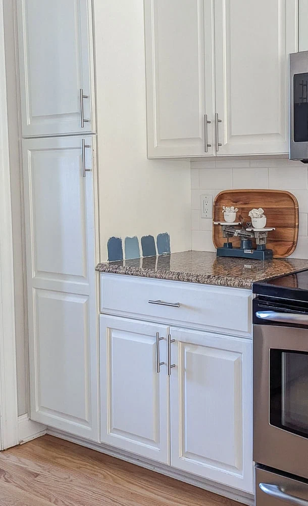 white cabinets with generic silver cabinet pulls.