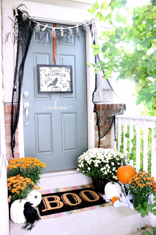 front entry decorated for Halloween with black mesh