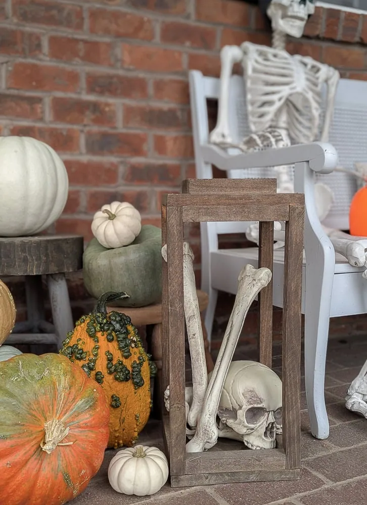pile of fake bones in wooden lantern.