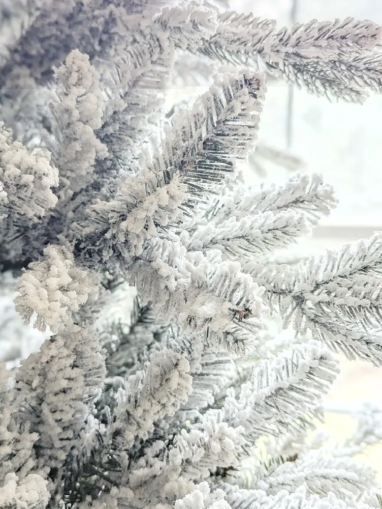 close up of flocked christmas tree