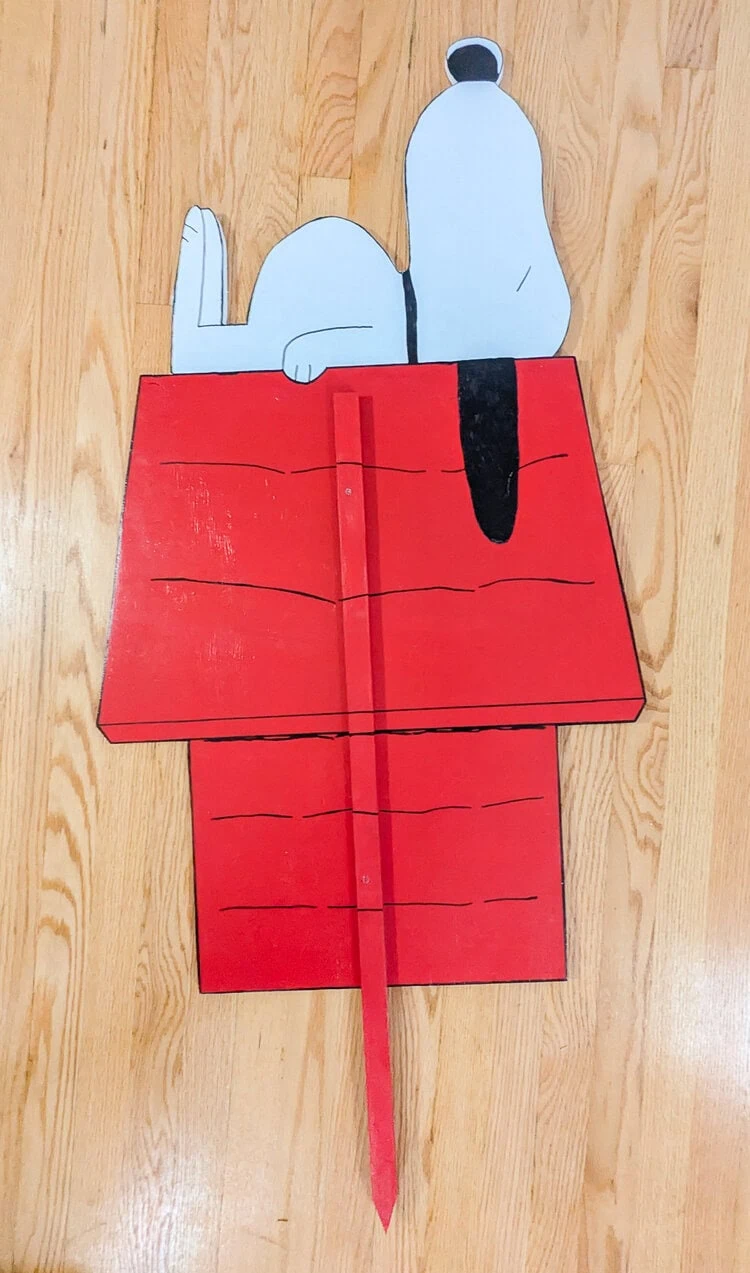 back of wood cutout of Snoopy on his doghouse once the wooden stake is added.